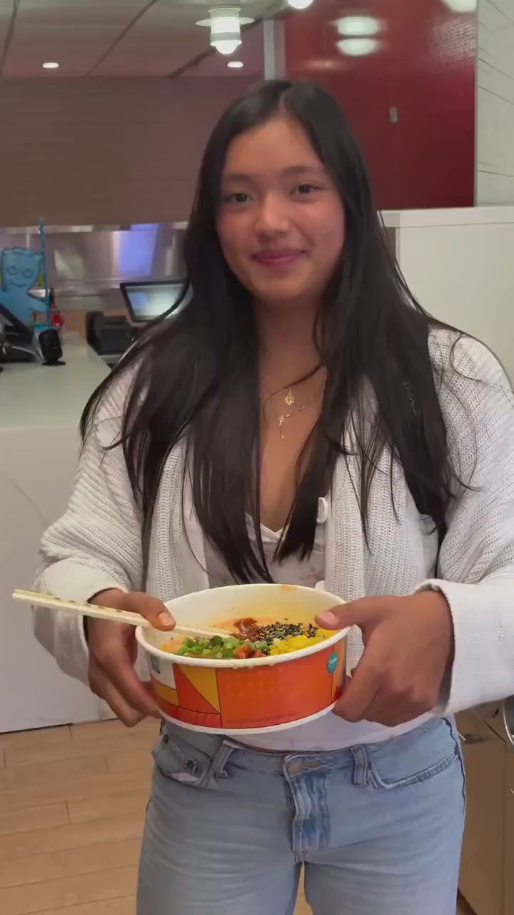 Students scanning, cooking and tasting ramen at a campus ramen spot in Evanston, Illinois